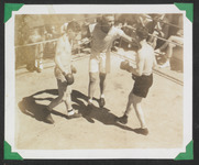 A referee separating the boxers
