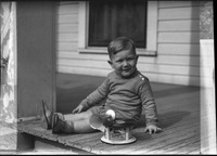 Young boy posing on deck