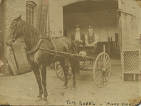 Fire chief and chauffeur sitting in carriage