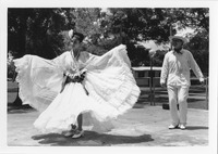 Woman and man posing in traditional costumes