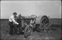 Man standing in front of a tractor
