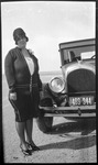Woman next to car