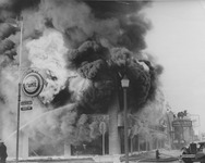 Firefighters fighting multi alarm fire with fire engine 8