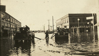 Firefighters on flooded street