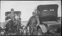 Hunters posing with ducks
