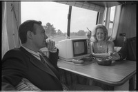 Carrie Nye smoking a cigarette in RV