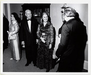 W. B. Bates socializing with Mary Hoffman and others