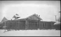 Brick house covered in snow
