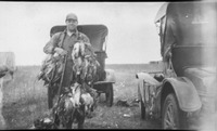Hunter posing with ducks
