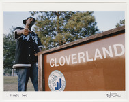 C-Note standing in front of park sign