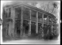 Front view of a two-story home with balcony upstairs