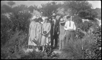 Group photo surrounded by foliage