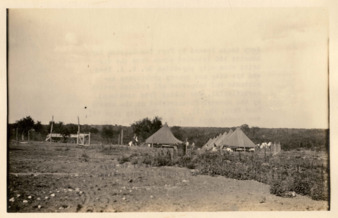 Two rows of fenced army tents loaned by Fort Sam Houston