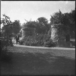 Man with two short stone towers