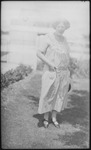 Woman posing with hat in hand