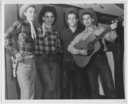 Four students with guitar