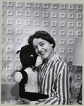 Sarah Beach poses with a puppet