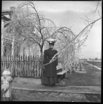 Woman posing under tree
