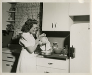 A woman making waffles