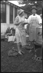 Man and woman wearing Maxwell House Coffee aprons
