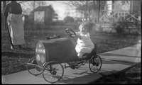Girl on pedal car