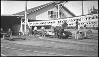 Group of men with horse at Walker Ship Yard