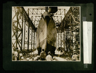 USS Houston (CA-30) slides down the ways with American flag displayed on its stern, launching ceremony