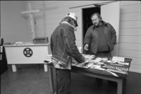 Man at table at the Ku Klux Klan Information Center