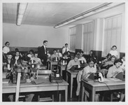 Students use calculators in a College of Business classroom