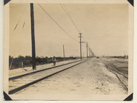 Man walking along reconstructed track at Oyster