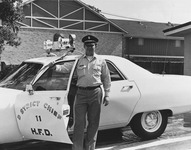 Houston Fire Chief standing next to emergency vehicle