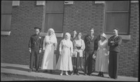 Sailors posing with Red Cross nurses