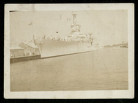 USS Houston (CA-30) docked with crew on deck
