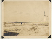 Man stands beside the reconstructed track at Oyster
