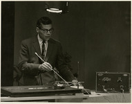 Man demonstrates audio equipment on screen