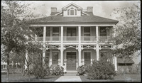 Woman posing on front porch