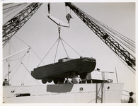 Crane lifting an amphibious automobile