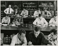 Professor and students in Geology classroom