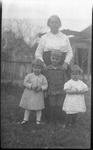 Woman posing with three young children