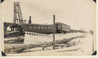 Two passenger cars being prepared for the temporary trestle