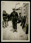 Marine Corps officer on deck with rifles