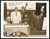 C.C. Pinkston posing with a xylophone and his band