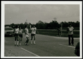 Photograph of Seneca Falls Torch being exchanged by Twiss Butler and Betty Yancey