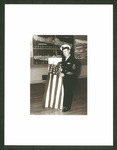 Jack L. Smith with American flag made in POW camp