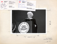 Ann Richards smiling and standing at a University of Houston podium