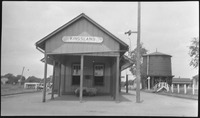 Small building with "KINGSLAND" sign