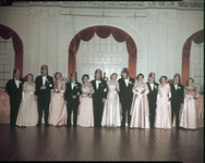 Group of people in formal attire standing side by side