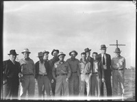 Group of men standing in field