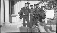 Three sailors with luggage