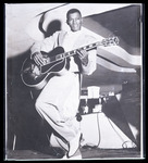 Clarence "Gatemouth" Brown posing with his guitar
